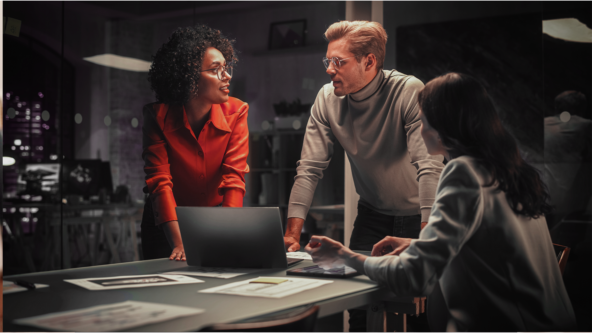 Recadi software developers collaborating on a custom build